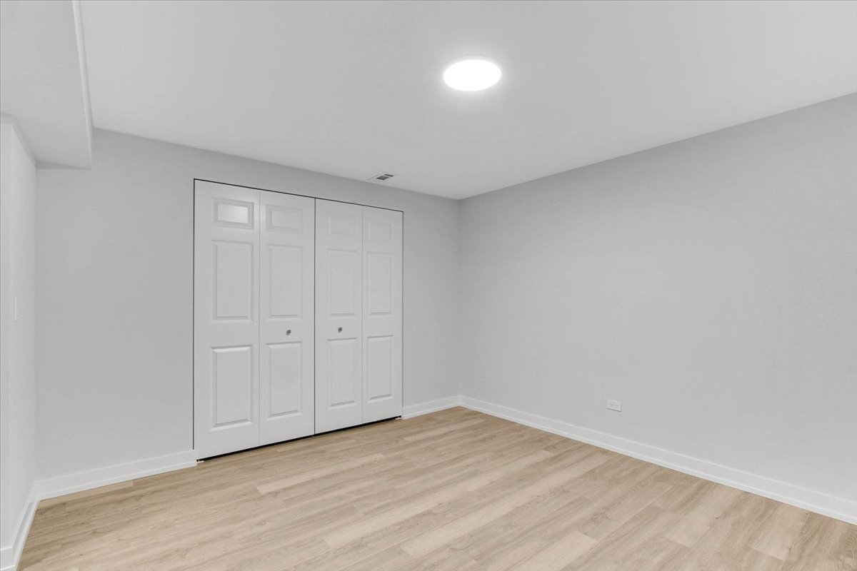 6705 Breckenridge Road Lisle, IL 60532 - Photo 34 of 41 a view of an empty room and wooden floor