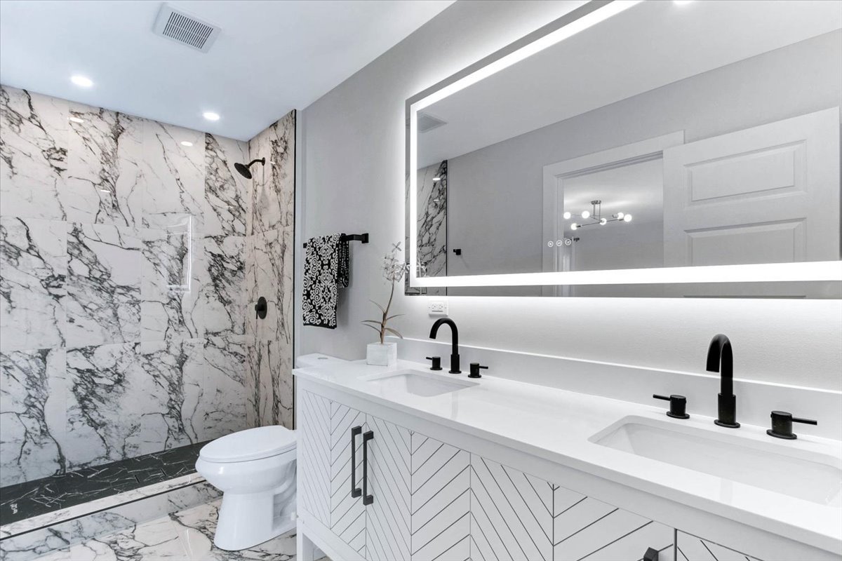 6705 Breckenridge Road Lisle, IL 60532 - Photo 6 of 41 a bathroom with a double vanity sink toilet and a mirror