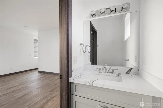 a bathroom with a sink and a mirror