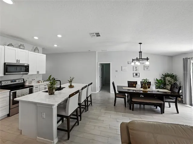 a view of a dining room with furniture