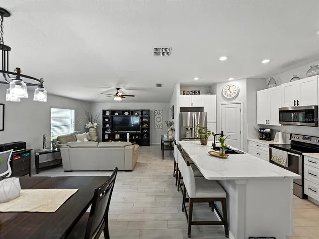 a kitchen with a table and chairs in it