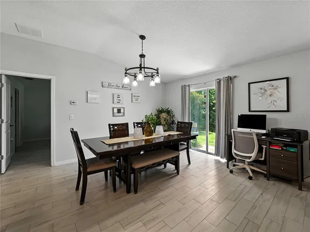 a view of a workspace with furniture and a livingroom