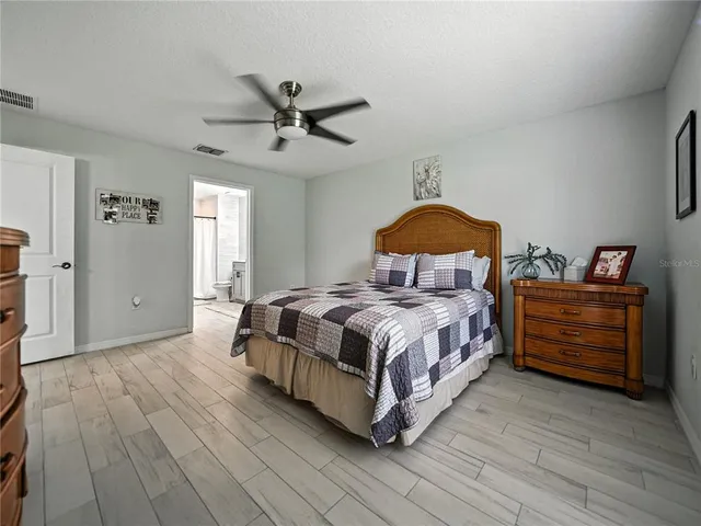 a bedroom with a bed and a dresser