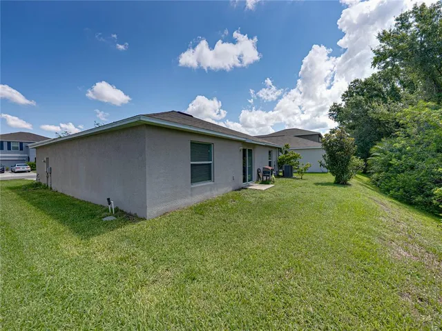 a view of a house with a big yard