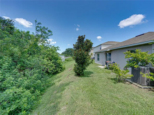 a view of a house with garden and plants