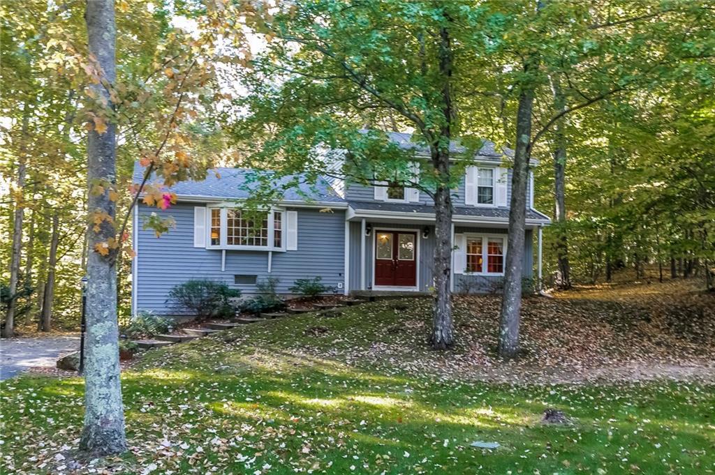 83 Woods End Road Guilford, CT 06437 - Photo 1 of 1 a view of a house with a yard