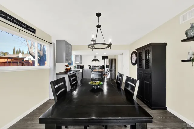 a view of a house with swimming pool and sitting area