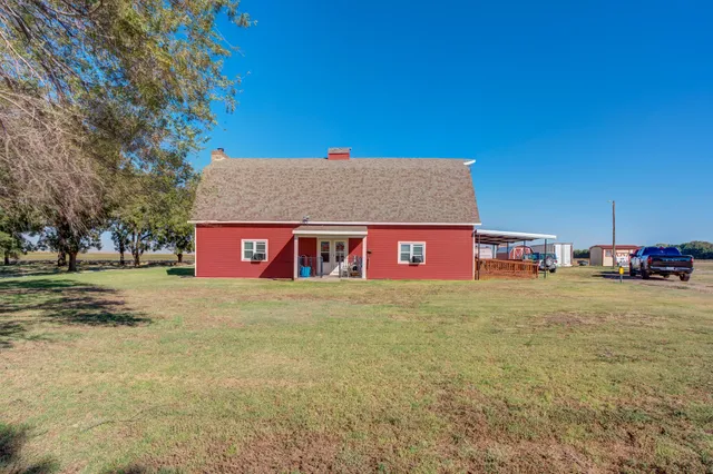 a room with a bed and a dresser