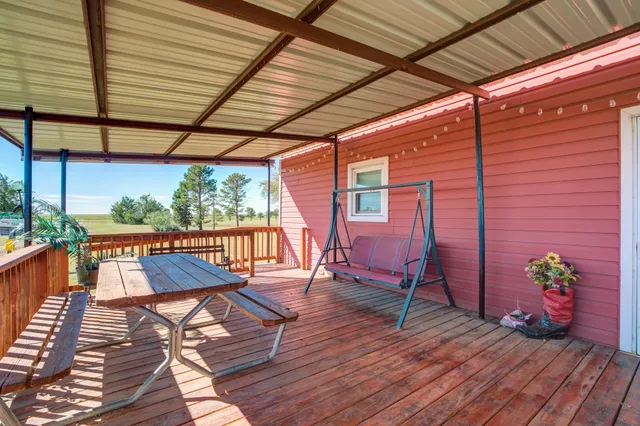 a living room with furniture a table and chairs