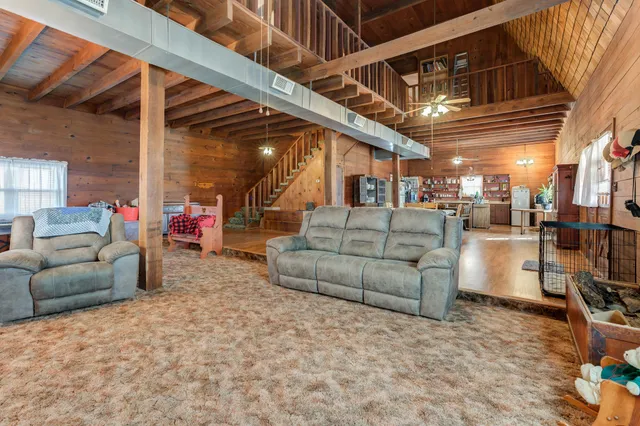 a outdoor space with lots of tables a garden view and chairs