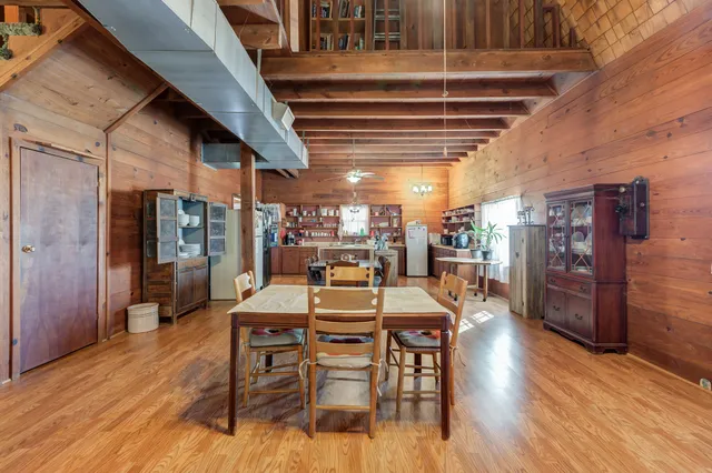 a room with granite countertop lots of wooden furniture