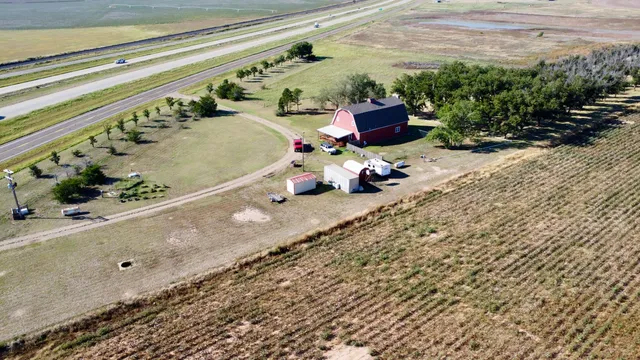 a view of a lake with a yard and outdoor seating