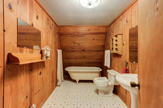 a bed room with a bed and a dresser