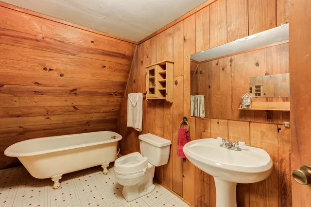a bed room with closet and flat screen tv