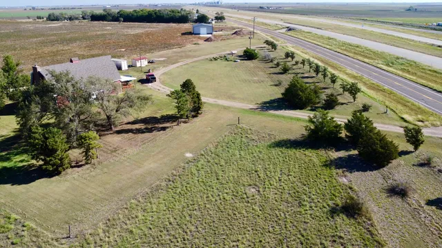 a view of a field with an ocean beach