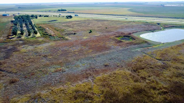a view of a terrace with wooden floor and a ocean view