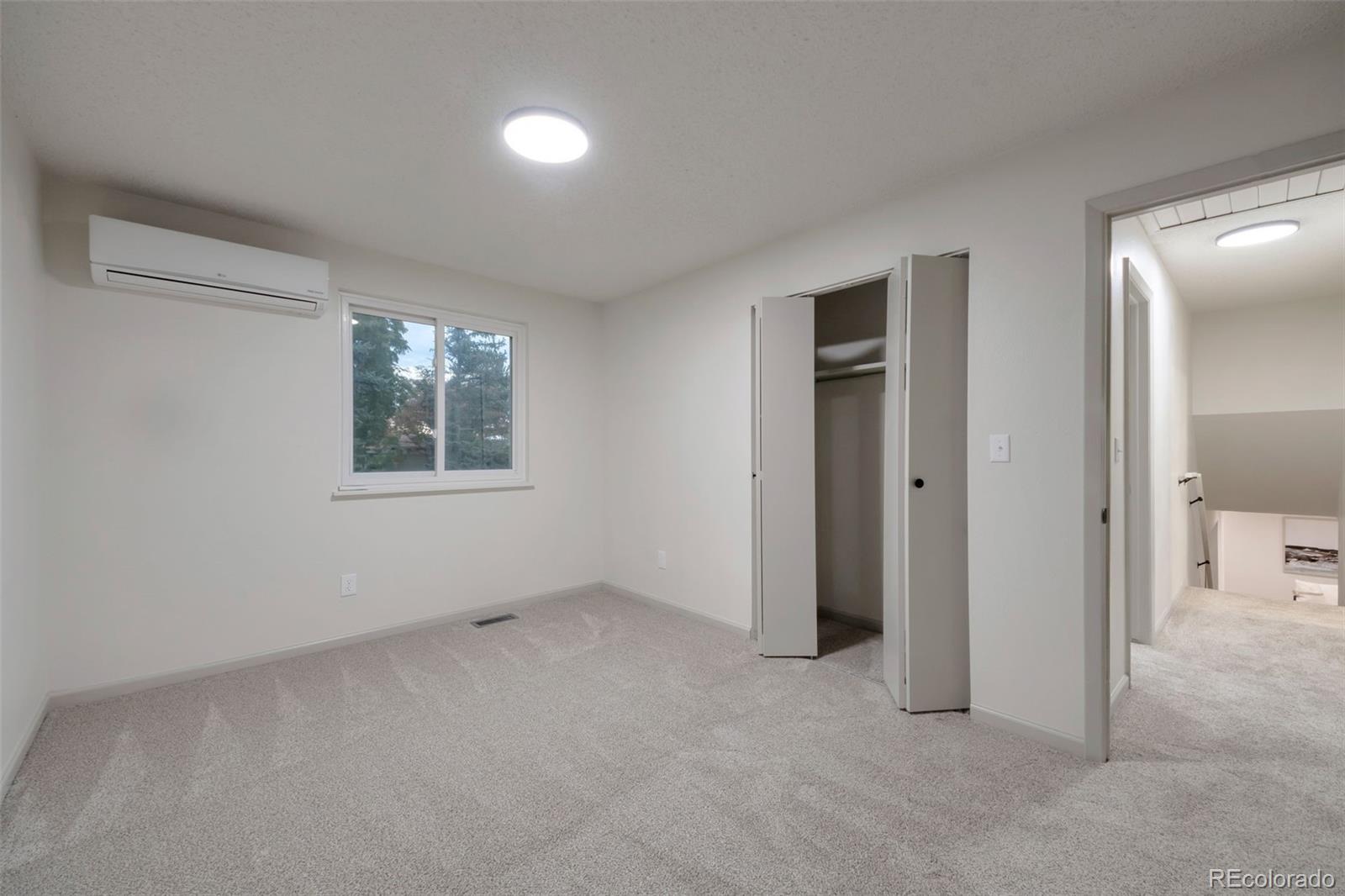7891 Durham Way Boulder, CO 80301 - Photo 13 of 18 an empty room with windows and closet
