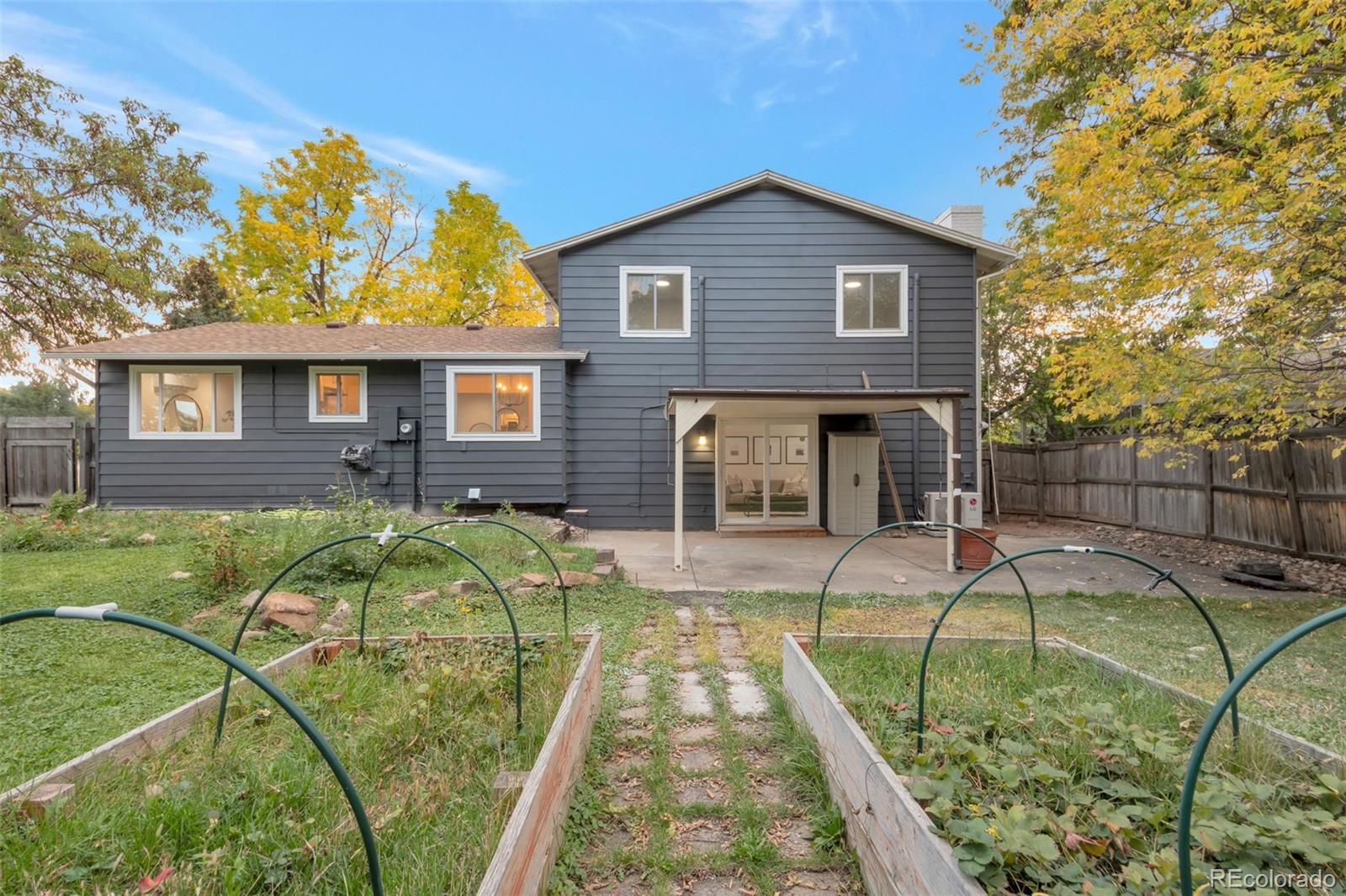 7891 Durham Way Boulder, CO 80301 - Photo 15 of 18 a house view with a swimming pool