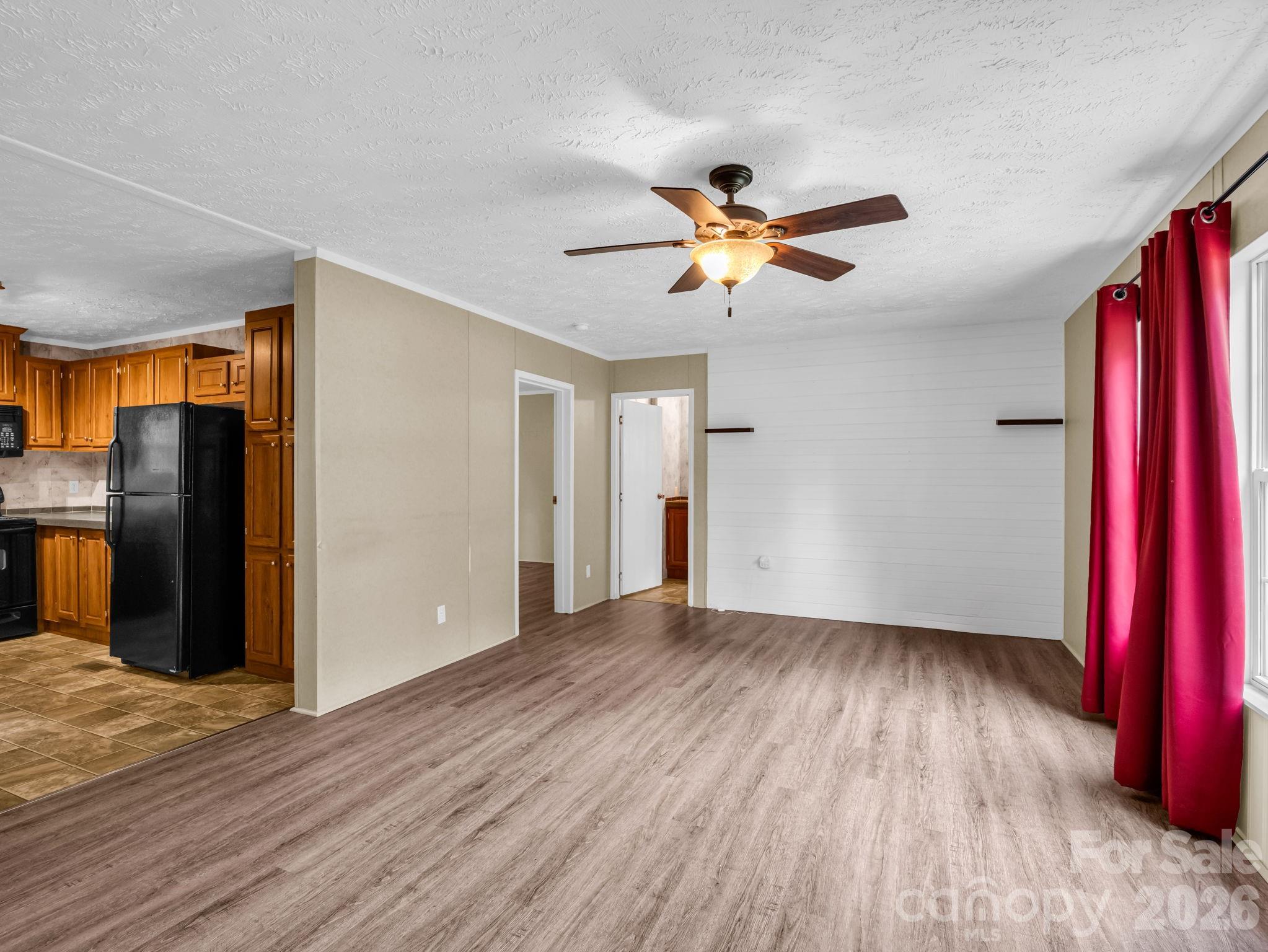 1449 Toney Road Bostic, NC 28018 - Photo 17 of 43 a view of empty room with wooden floor and fan