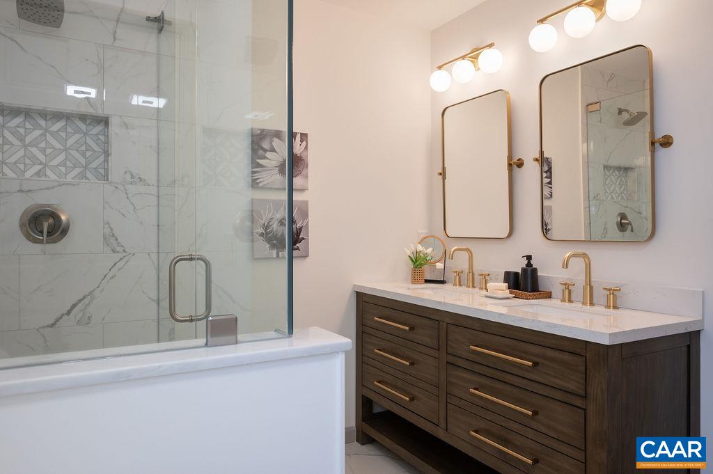 1232 Durrett Ridge Road Earlysville, VA 22936 - Photo 21 of 48 a bathroom with a double vanity sink mirror and shower