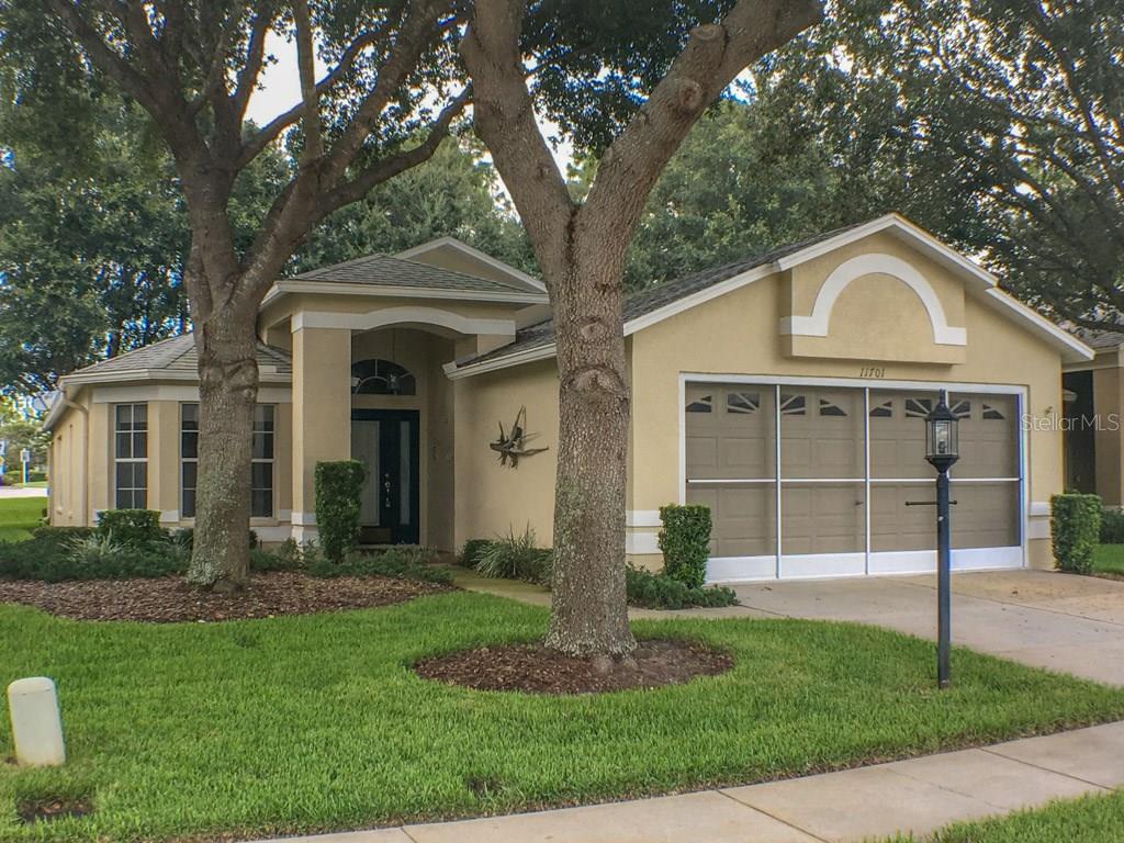 11701 Wheatfield Loop Hudson, FL 34667 - Photo 1 of 1 a front view of a house with a yard
