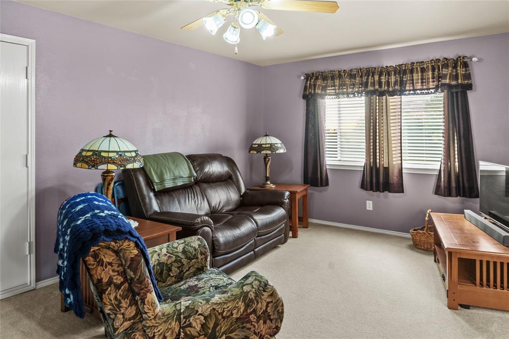 1413 Rodeo Drive Murphy, TX 75094 - Photo 15 of 29 a living room with furniture and a window