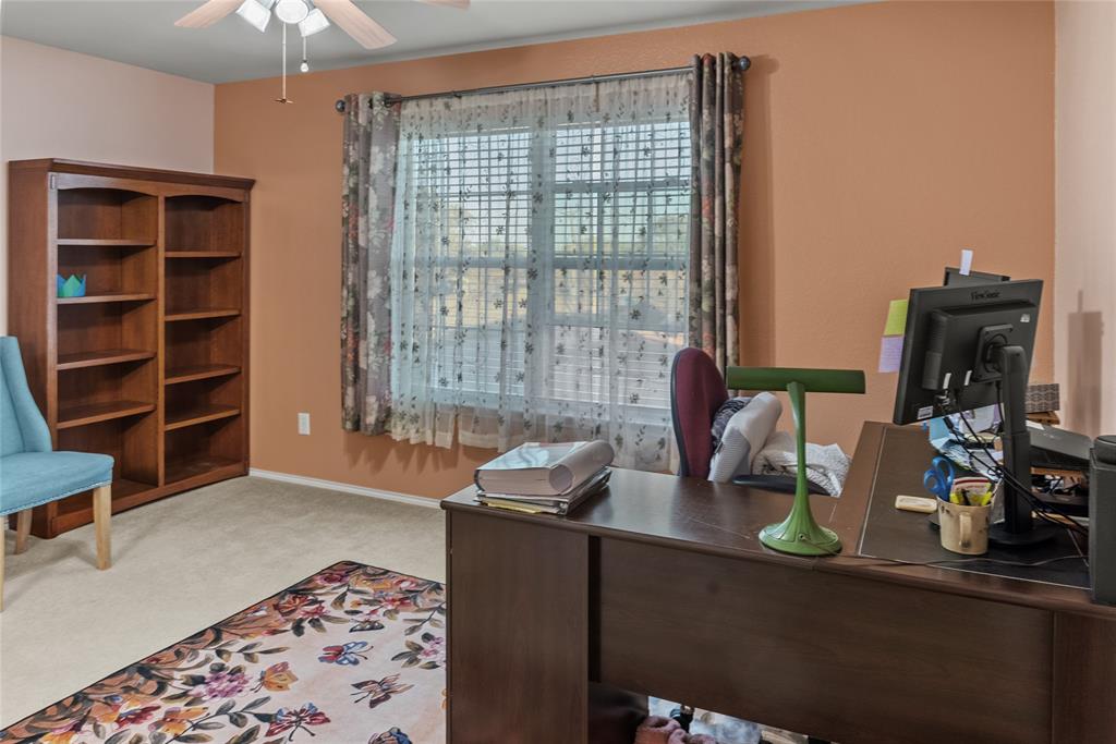 1413 Rodeo Drive Murphy, TX 75094 - Photo 16 of 29 a room with furniture and a chandelier