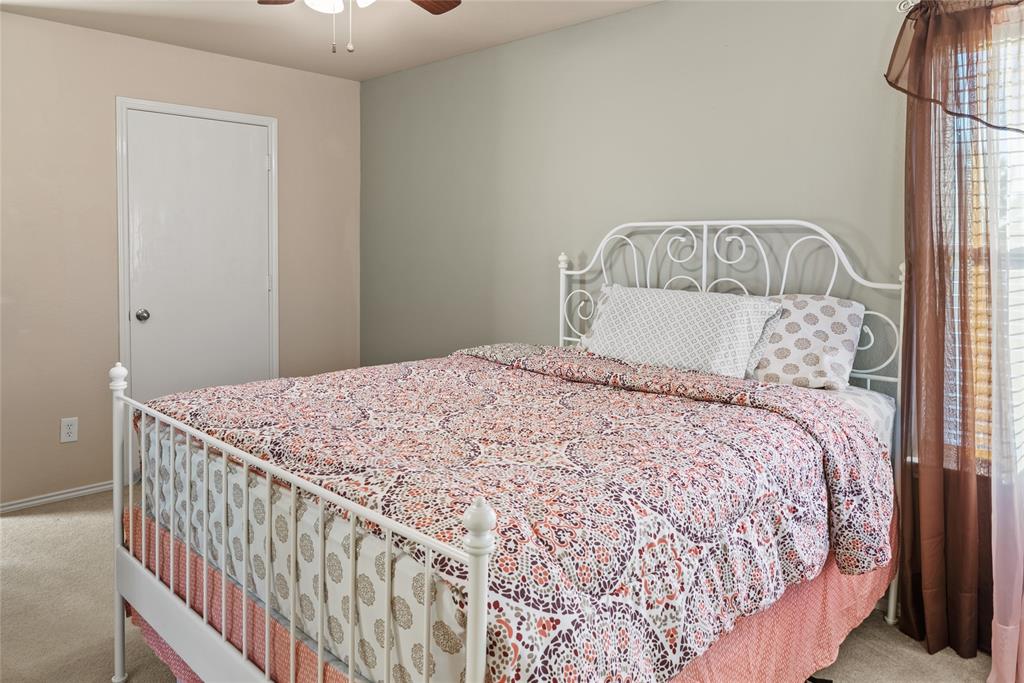 1413 Rodeo Drive Murphy, TX 75094 - Photo 18 of 29 a bedroom with a bed and a window