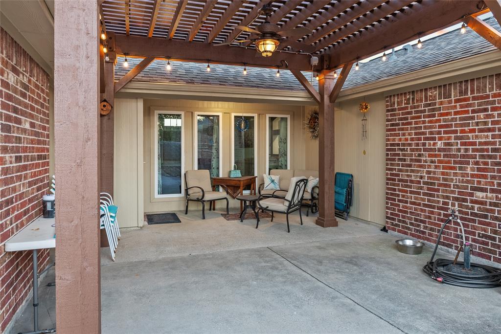 1413 Rodeo Drive Murphy, TX 75094 - Photo 19 of 29 a view of a patio with table and chairs