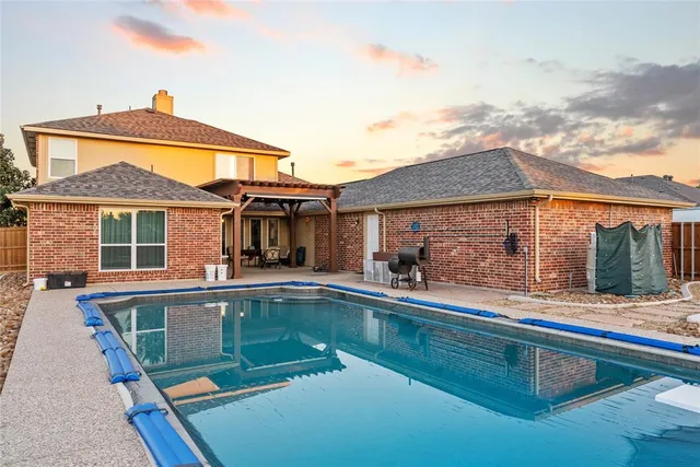 front view of a house with a swimming pool