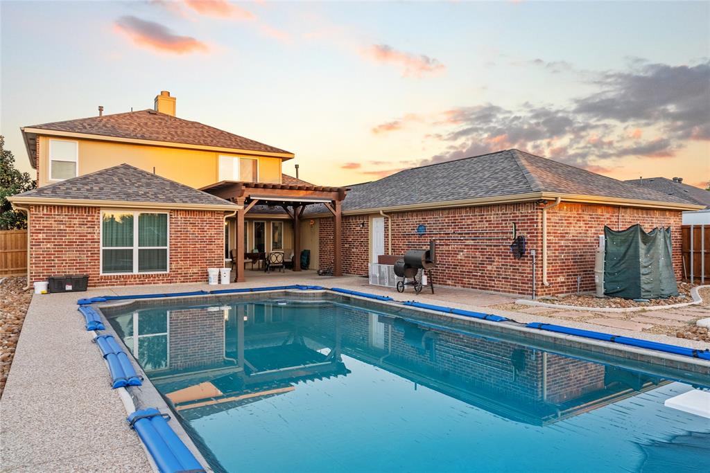 1413 Rodeo Drive Murphy, TX 75094 - Photo 20 of 29 front view of a house with a swimming pool