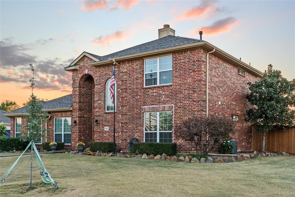 1413 Rodeo Drive Murphy, TX 75094 - Photo 25 of 29 a front view of a house with a yard