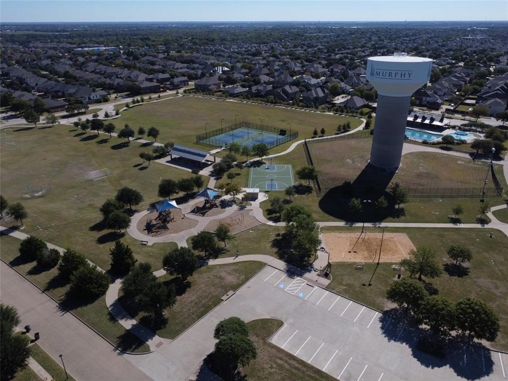 1413 Rodeo Drive Murphy, TX 75094 - Photo 29 of 29 an aerial view of a house with a lake view