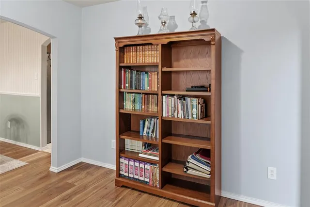 a workspace with wooden floor and closet