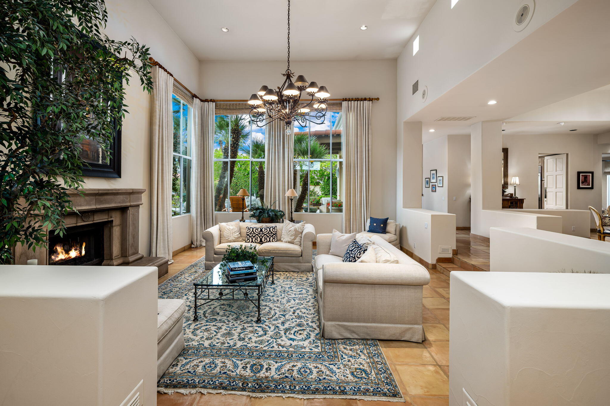 45595 Apache Road Indian Wells, CA 92210 - Photo 11 of 58 a living room with fireplace furniture and a chandelier