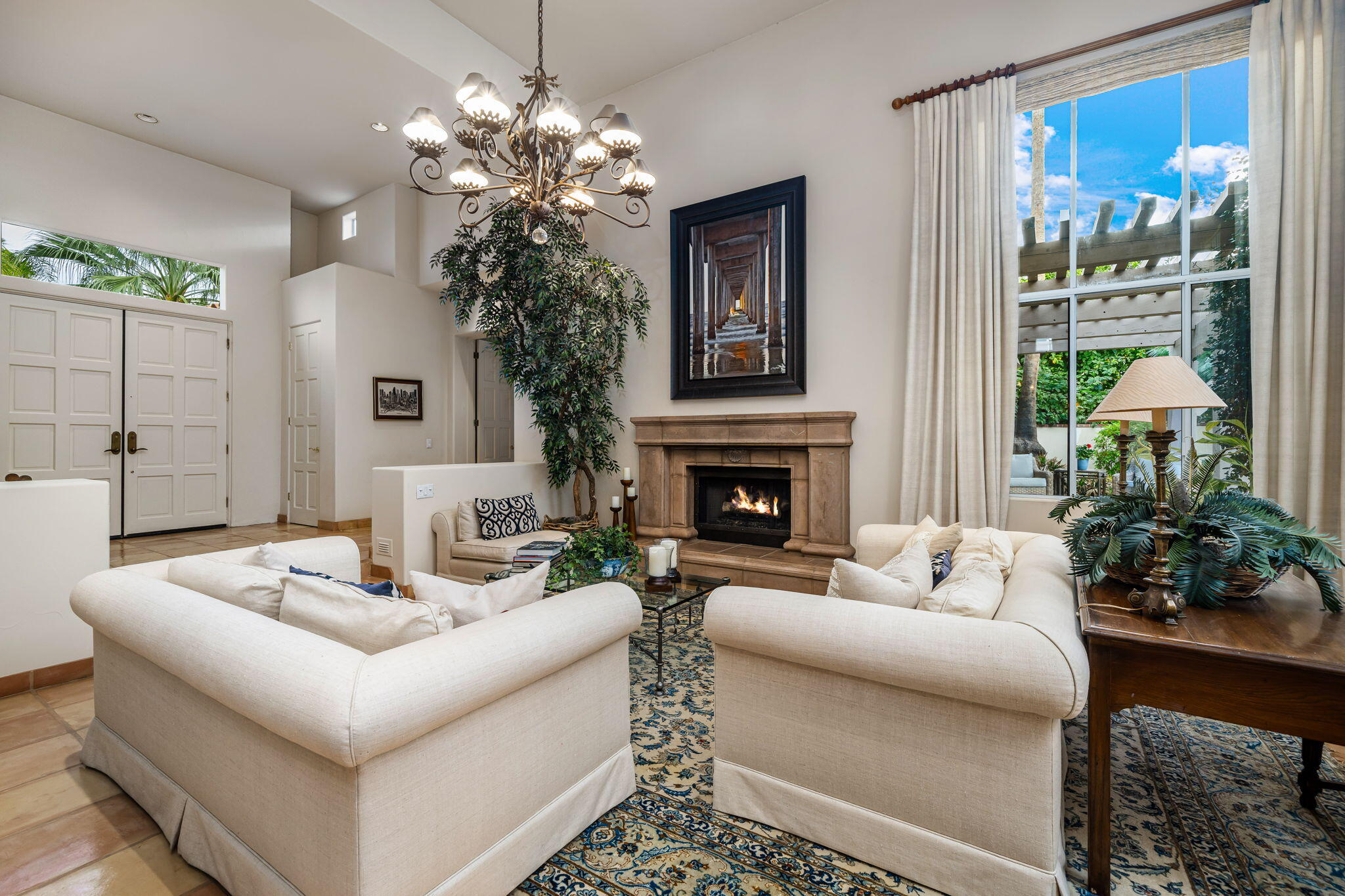 45595 Apache Road Indian Wells, CA 92210 - Photo 14 of 58 a living room with furniture and a fireplace