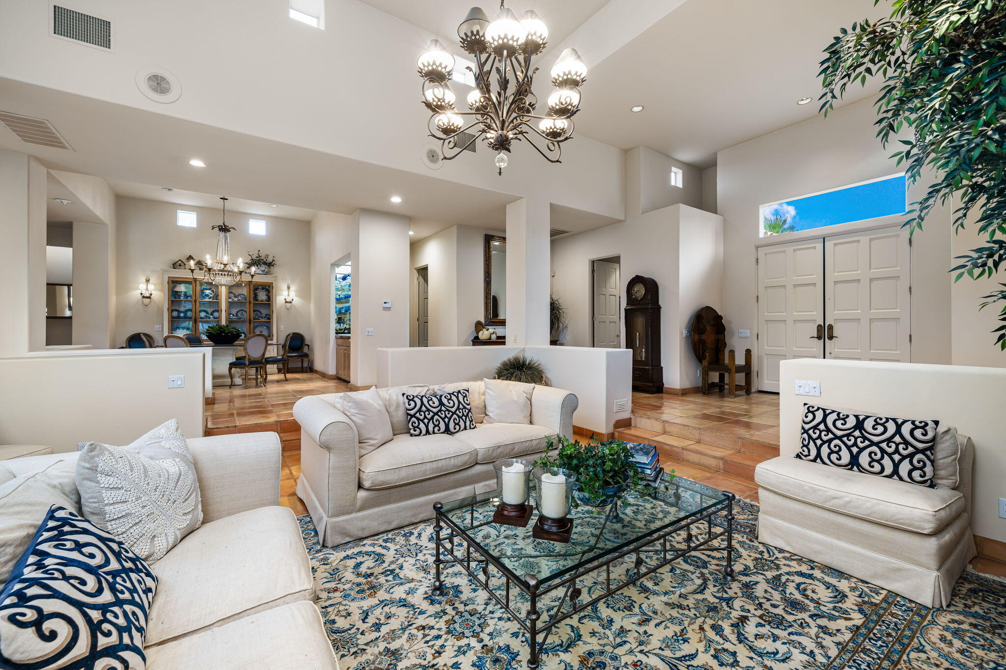 45595 Apache Road Indian Wells, CA 92210 - Photo 15 of 58 a living room with furniture and a chandelier