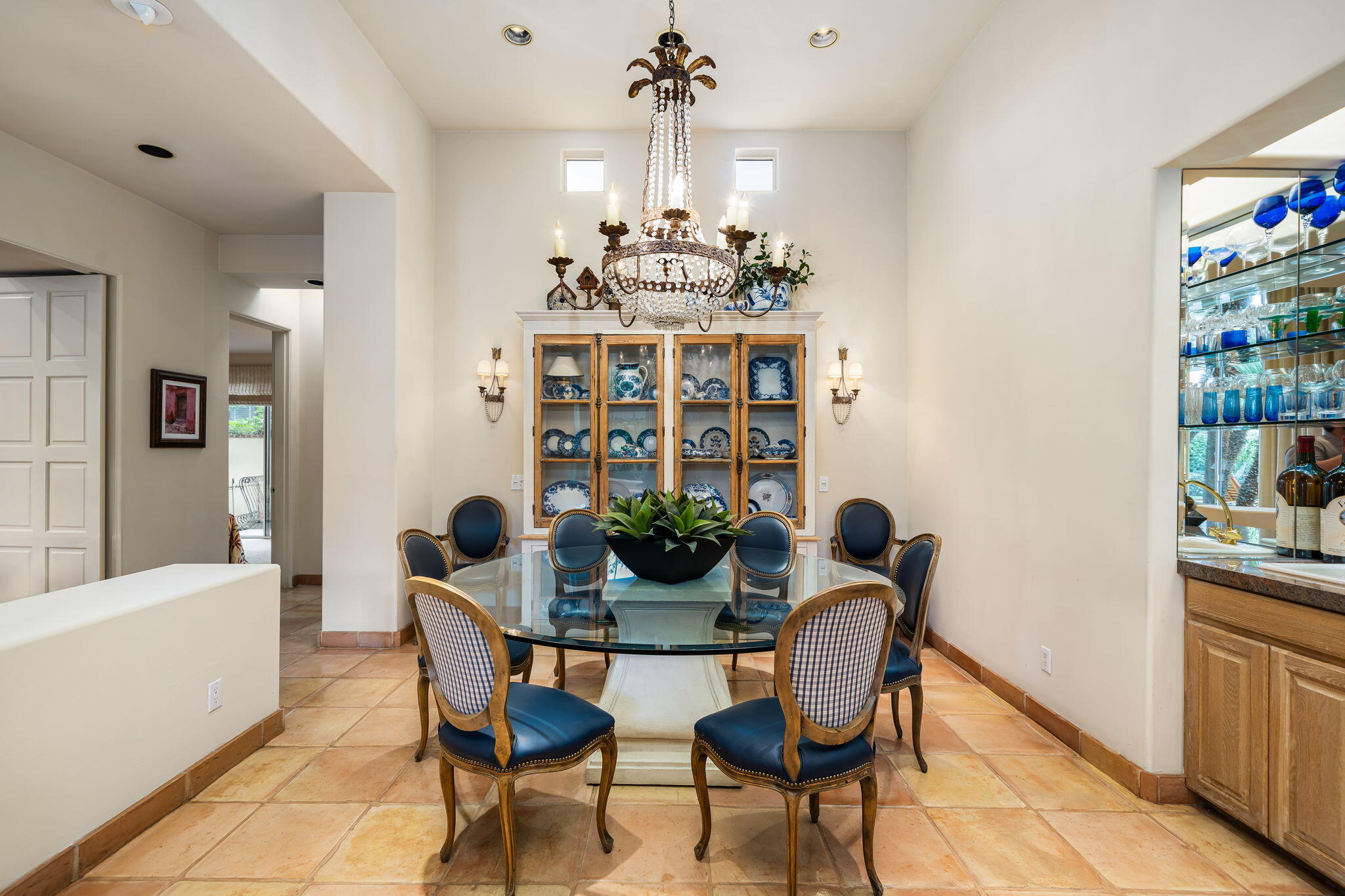 45595 Apache Road Indian Wells, CA 92210 - Photo 16 of 58 a view of a dining room with furniture and chandelier