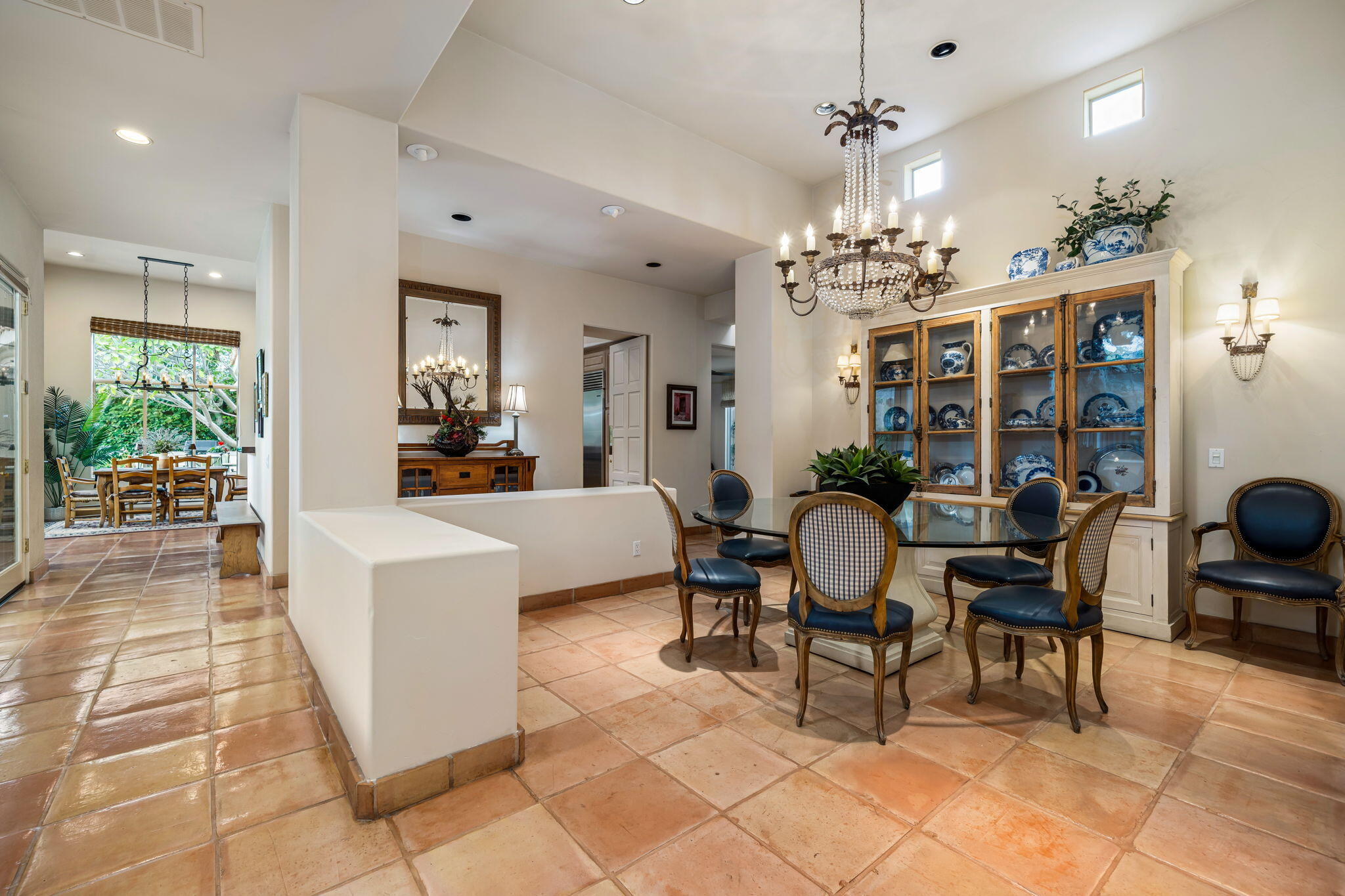 45595 Apache Road Indian Wells, CA 92210 - Photo 17 of 58 a view of a dining room with furniture a chandelier and wooden floor