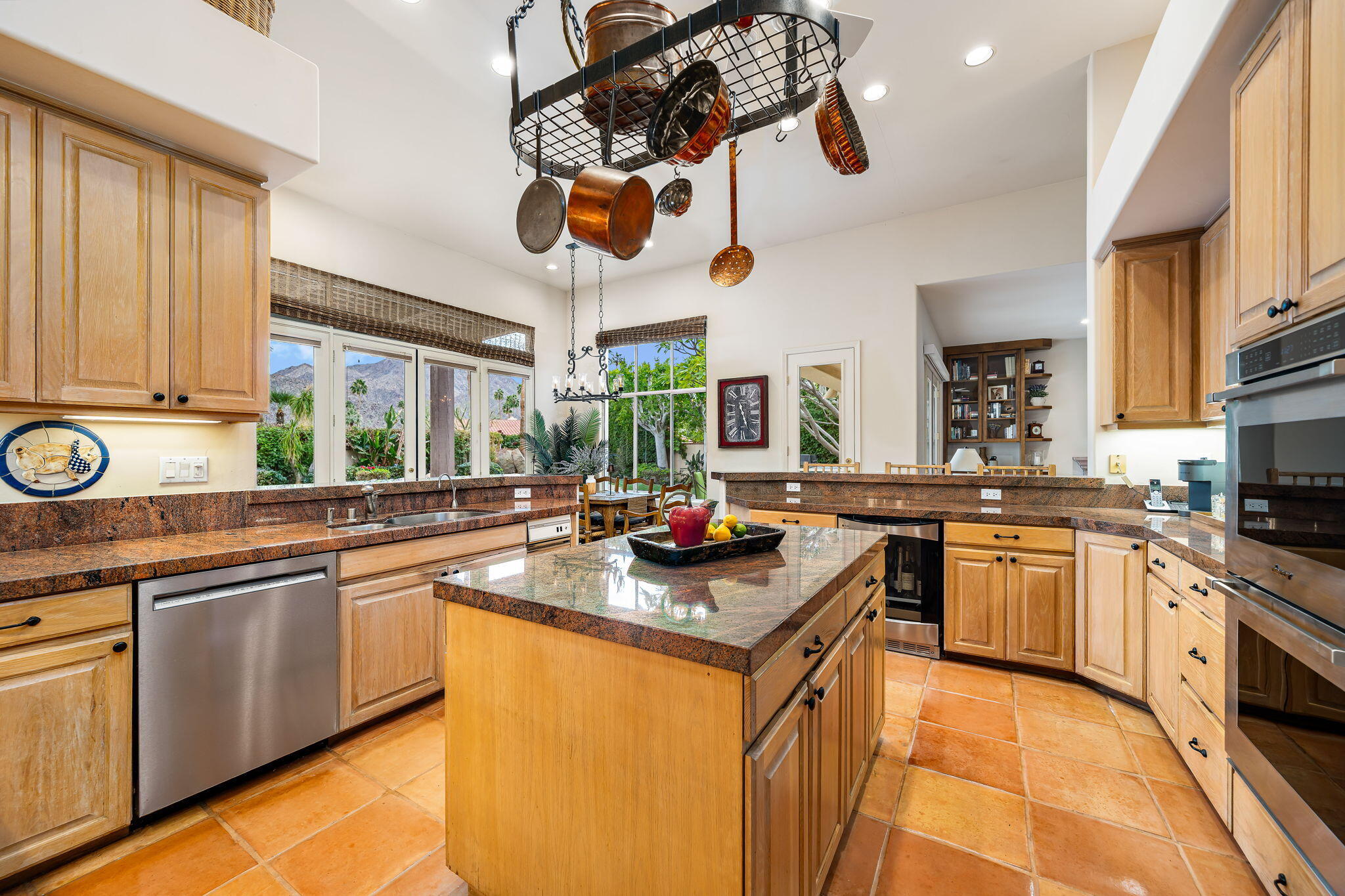 45595 Apache Road Indian Wells, CA 92210 - Photo 24 of 58 a kitchen with stainless steel appliances granite countertop a stove and a sink