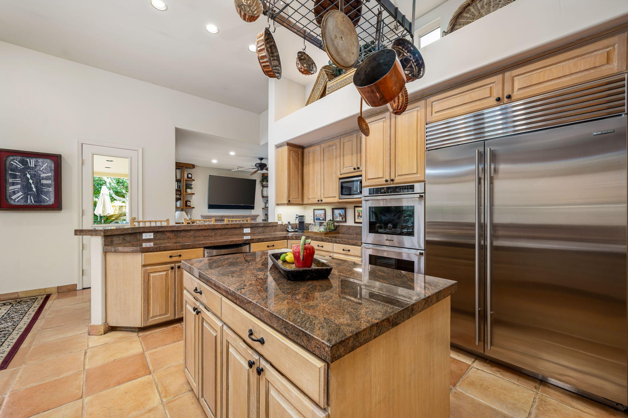 45595 Apache Road Indian Wells, CA 92210 - Photo 25 of 58 a kitchen with stainless steel appliances granite countertop a sink and a counter