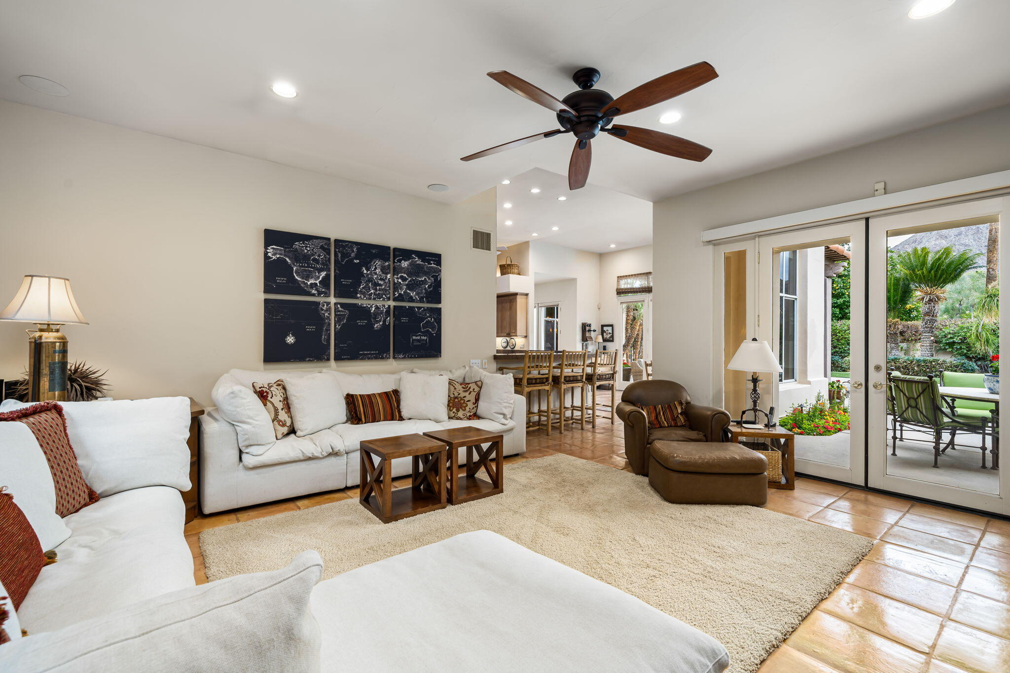 45595 Apache Road Indian Wells, CA 92210 - Photo 29 of 58 a living room with furniture a ceiling fan and a large window