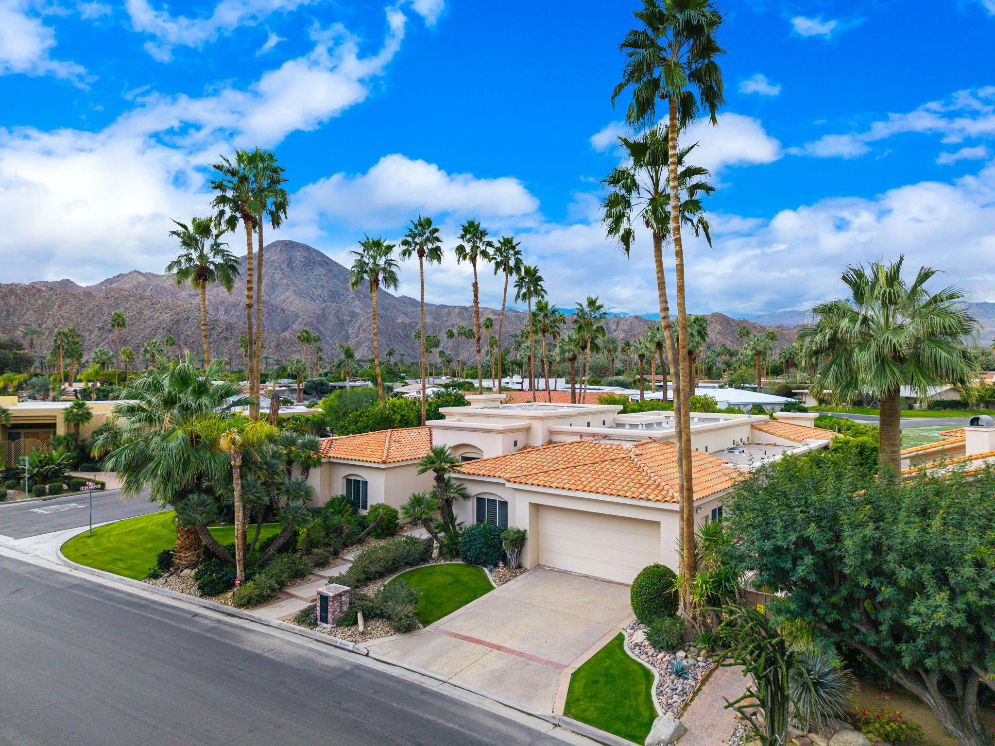 45595 Apache Road Indian Wells, CA 92210 - Photo 3 of 58 a view of a swimming pool with a patio