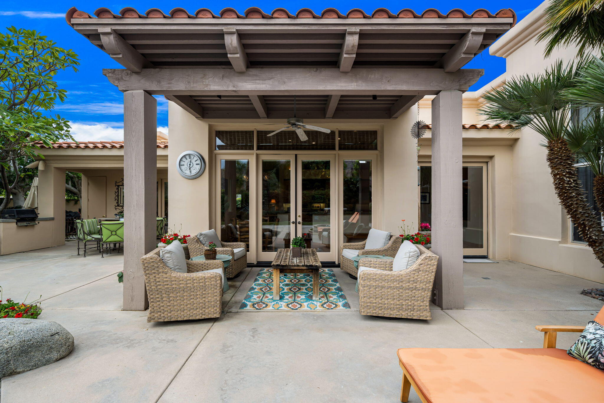 45595 Apache Road Indian Wells, CA 92210 - Photo 37 of 58 a building outdoor space with patio furniture and potted plants