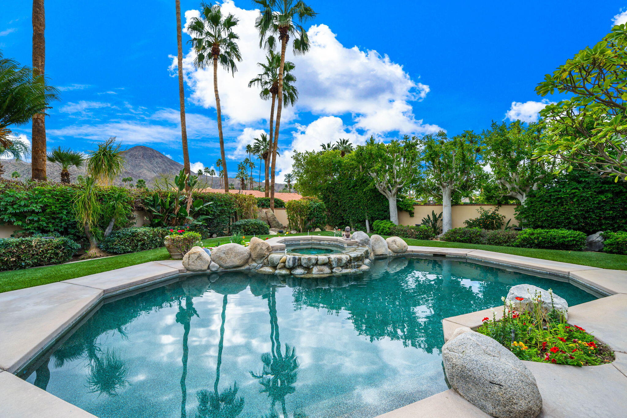 45595 Apache Road Indian Wells, CA 92210 - Photo 38 of 58 a view of a swimming pool with a patio