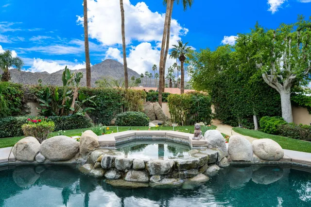 a reading room with furniture and a book shelf
