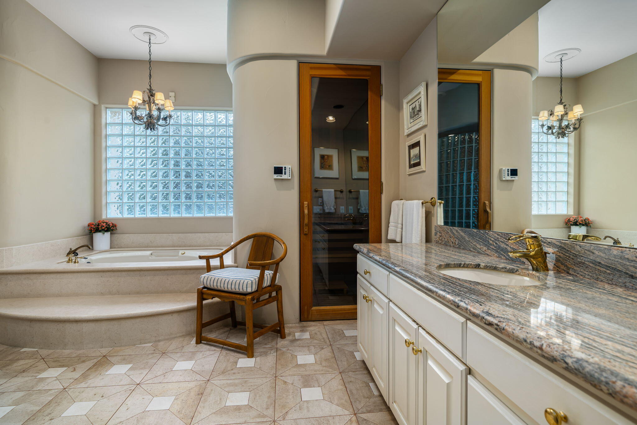 45595 Apache Road Indian Wells, CA 92210 - Photo 46 of 58 a bathroom with a granite countertop sink and a bathtub