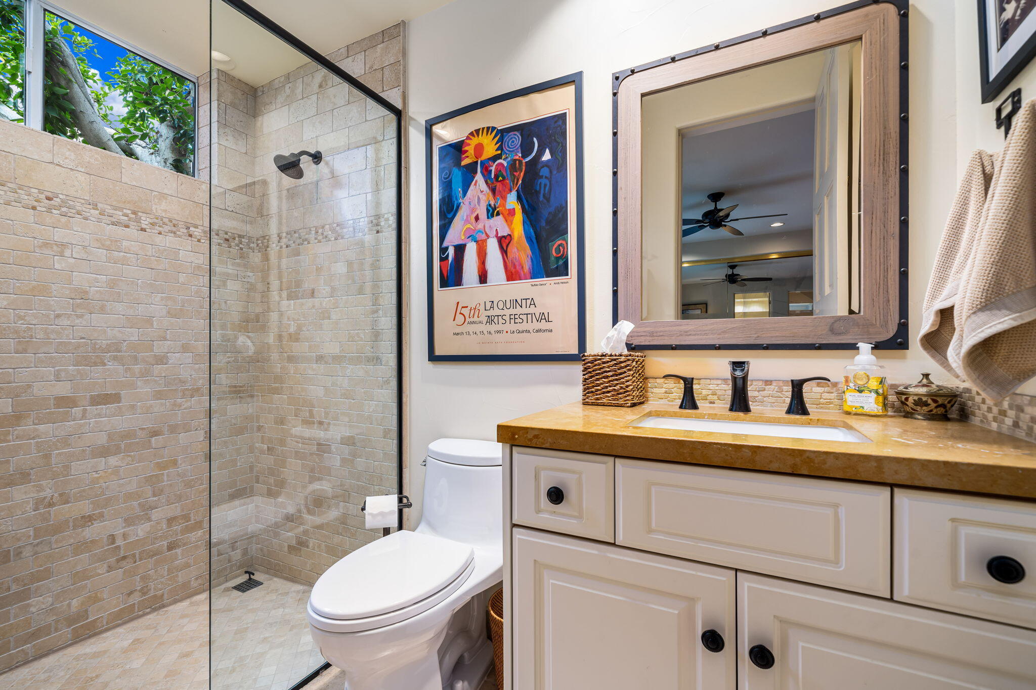 45595 Apache Road Indian Wells, CA 92210 - Photo 53 of 58 a bathroom with a toilet a sink and mirror