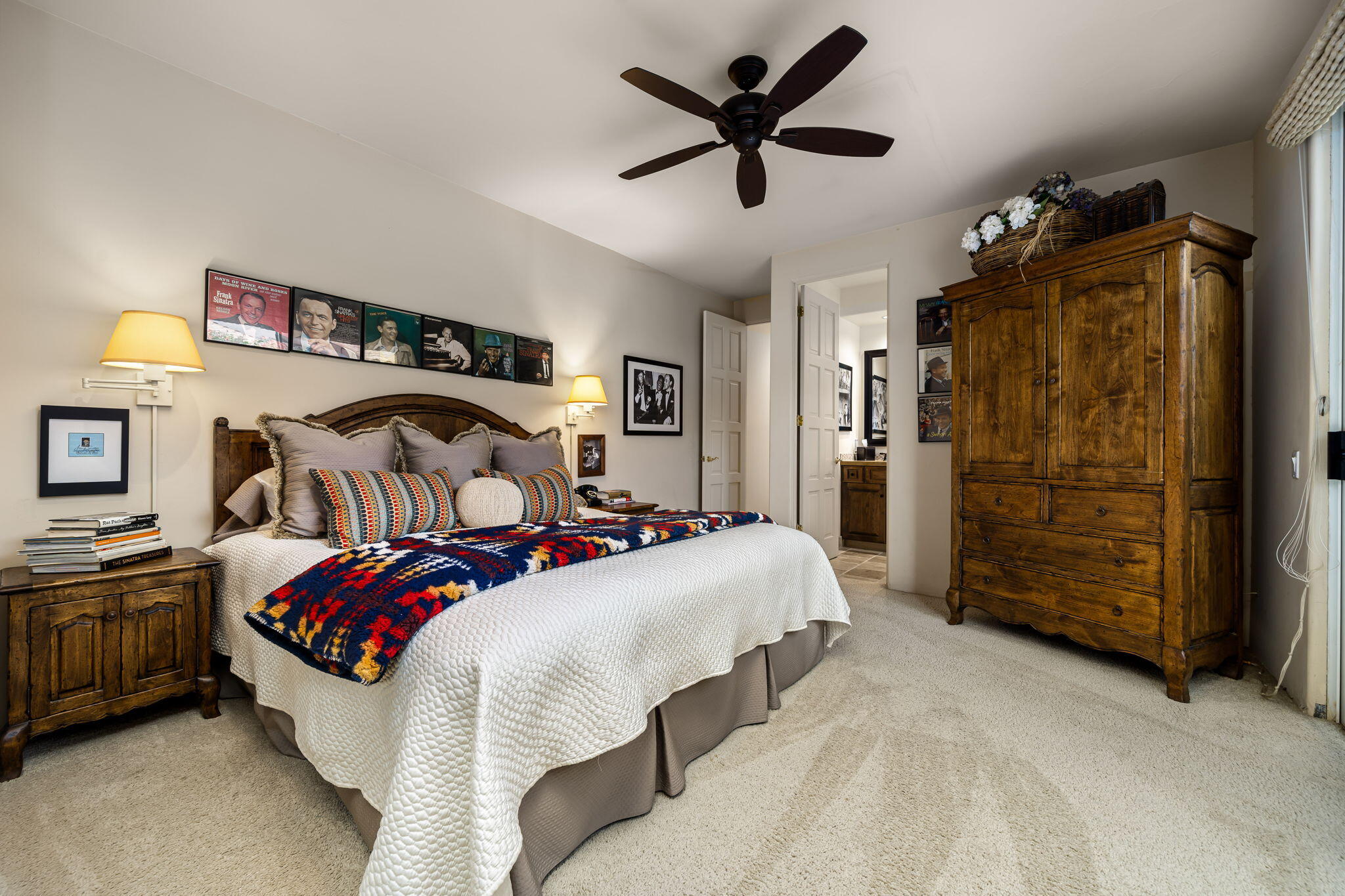 45595 Apache Road Indian Wells, CA 92210 - Photo 54 of 58 a bedroom with bed and a chandelier