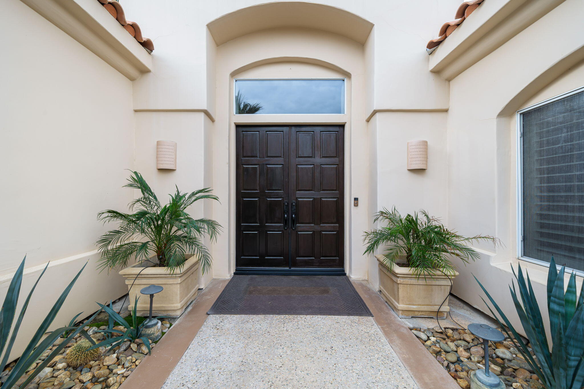 45595 Apache Road Indian Wells, CA 92210 - Photo 9 of 58 a view of entrance gate of a house with potted plants